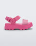 Side view of a Mini Melissa Kick Off platform sandal in pink with adjustable velcro ankle strap.