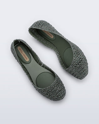 Top and side angled view of a pair of green glitter Campana flats