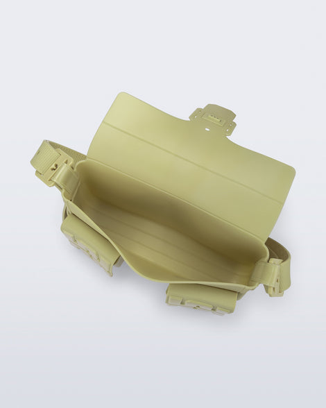 Top view of a pastel green Cargo bag with two small pockets on the front and an adjustable strap