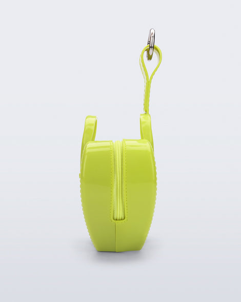 Side view of a green Heartbeat Pocket bag charm