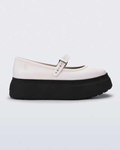 Side view of a white Soft Ballerina Platform flats with black sole
