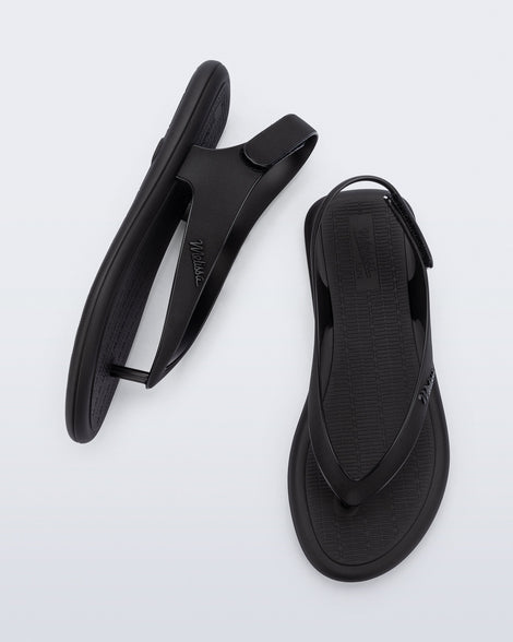 Side and top view of a pair of black Sun Samba thong sandals