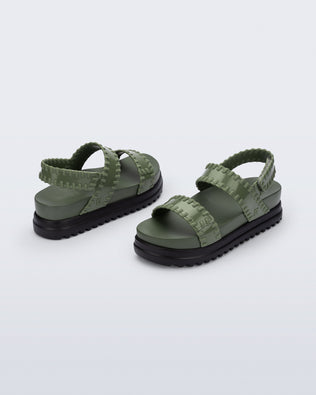Back and angled view of a pair of green Dune Platform Sandals with faux stitching on the straps and black sole