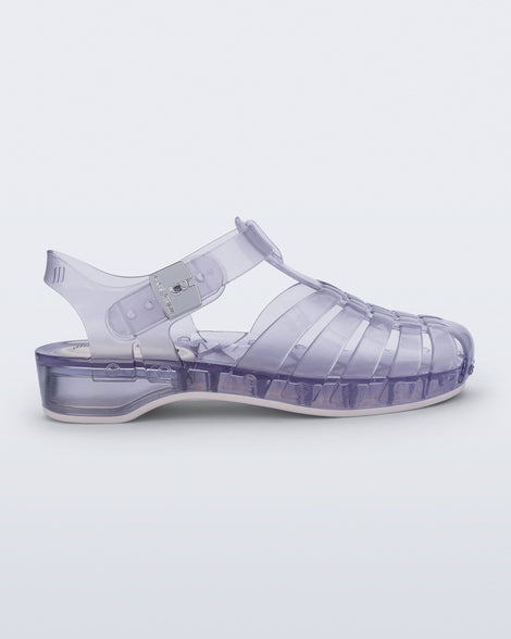 Side view of a clear Possession Pescura + Scholl fisherman sandal with white bottom sole