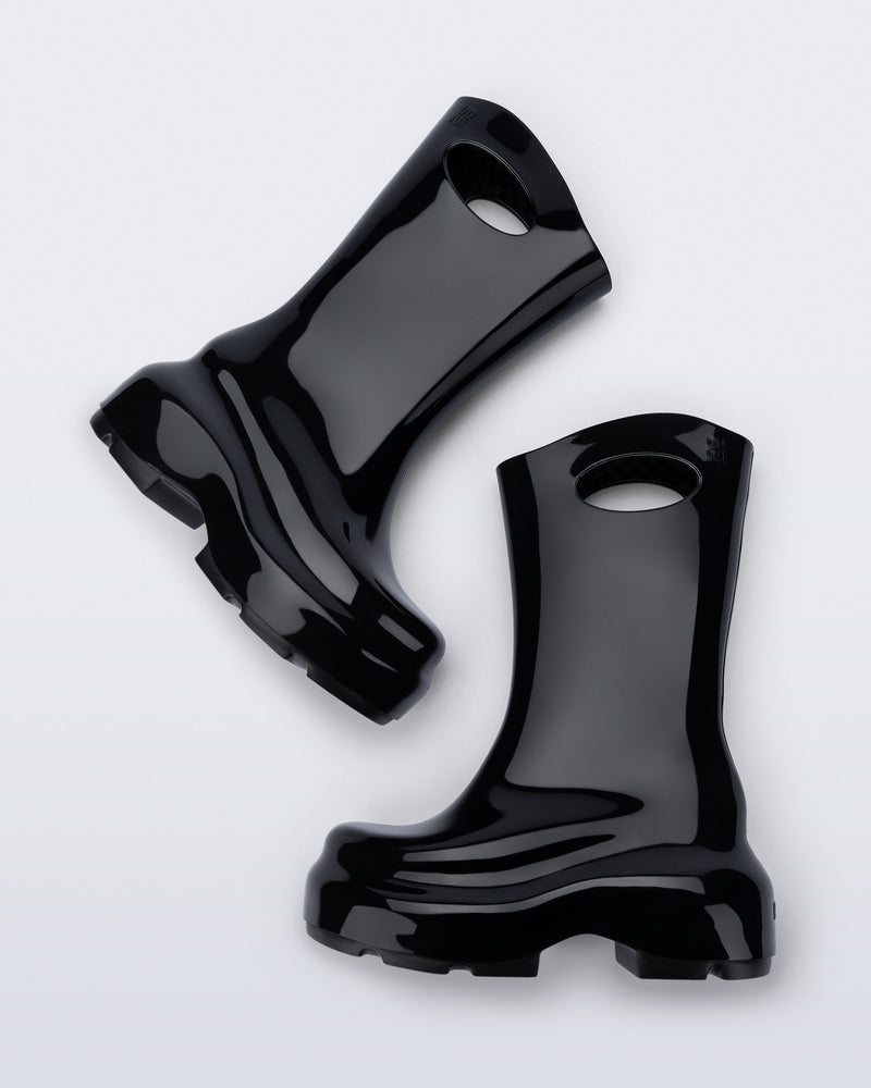 Top view of a pair of black Ultra platform rain Boot with circle cutout on top