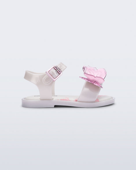 Side view of a pearly white baby Butterfly Sandals with pink butterfly