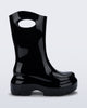 Side view of a black Ultra platform rain Boot with circle cutout on top