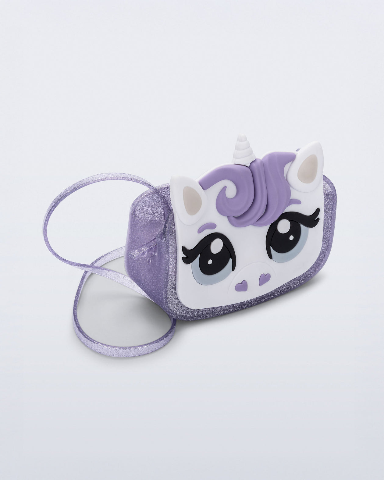 Angled view of a lilac glitter Dreamy Unicorn kids bag with a unicorn face on front with lilac hair