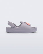 Side view of a grey Free Cute baby sandal with hippo face on front upper 
