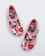 Top view of a pair of pink Ultragirl + Hello Kitty and Friends baby flats with Hello Kitty and a Heart on the upper
