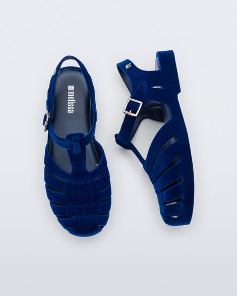 Side and top view of a pair of flocked blue Possession Velvet fisherman sandals