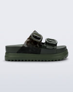Side view of a dark green Cozy Platform slide with two straps with buckles