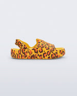 Side view of a yellow Free Cute baby sandal with leopard print