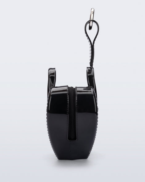 Side view of a black Heartbeat Pocket bag charm