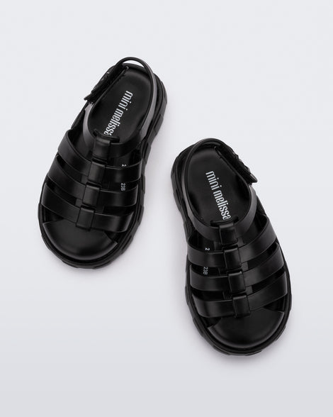 Top view of a pair of black Megan baby sandals.