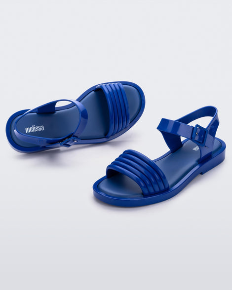 Angled view of a pair of blue Mar Wave women's sandals.
