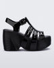 Side view of a black Station 79 platform heel with ankle strap