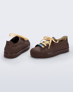 Back and angled view of a pair of brown Wow Sneakers with beige laces