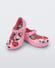 Angled view of a pair of pink Ultragirl + Hello Kitty and Friends baby flats with Hello Kitty and a Heart on the upper