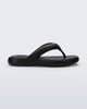 Side view of a black Free Low flip flop