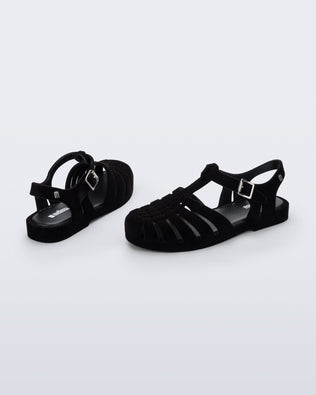 Side and back angled view of a pair of flocked black Possession Velvet fisherman sandals