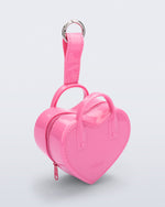 Angled view of a pink Heartbeat Pocket bag charm