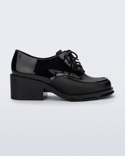 Side view of a black Tailor loafer with laces