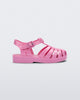 Side view of a pink Mini Melissa Possession sandal with a fisherman sandal design