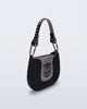 Angled view of a black Nina Bag + Alexandre Pavao shoulder bag with grey accents