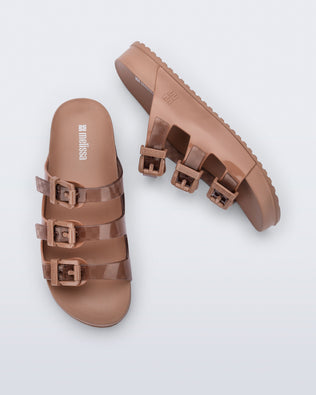 Top and side view of a pair of brown Cozy Stripes sandals with transparent brown upper with 3 buckles