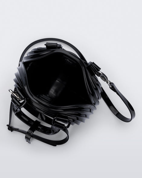Top view of a black Quantum Dome + Diesel bag with hand strap and shoulder strap
