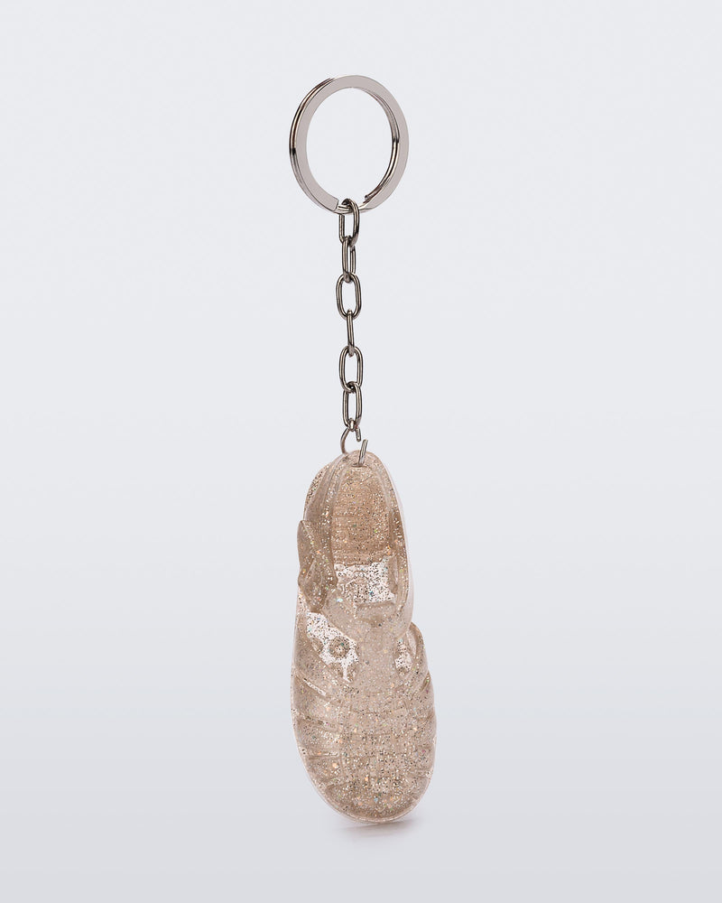 Front view of glitter beige Possession keyring
