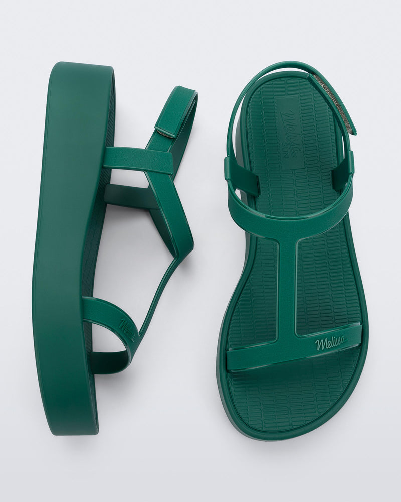Top and side view of a pair of green Sun Capri Platform sandals with ankle straps