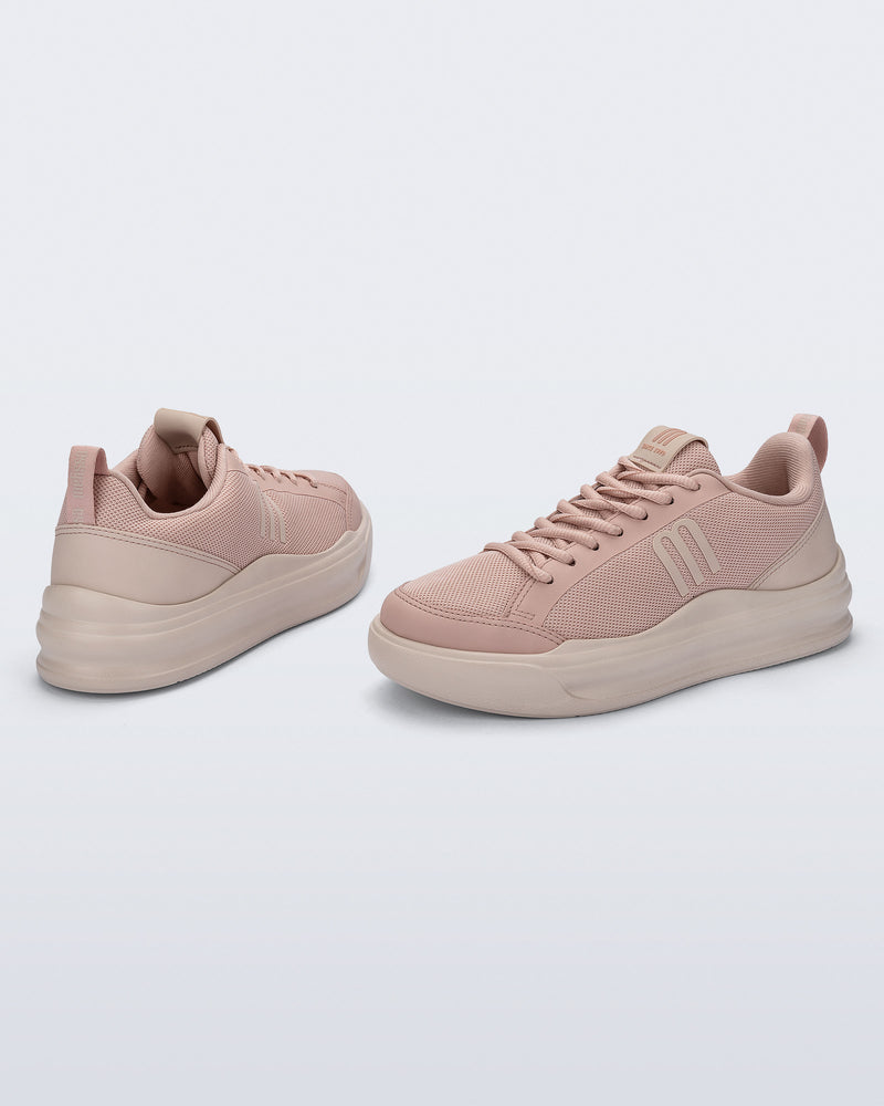 Back and angled view of a pair of pink X Mood sneakers