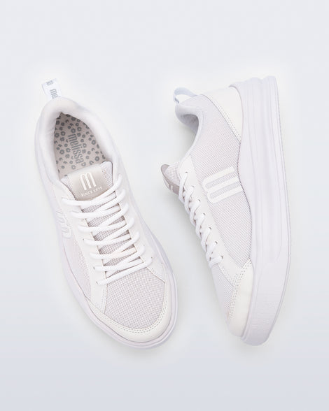 Top and side view of a pair of white X Mood sneakers