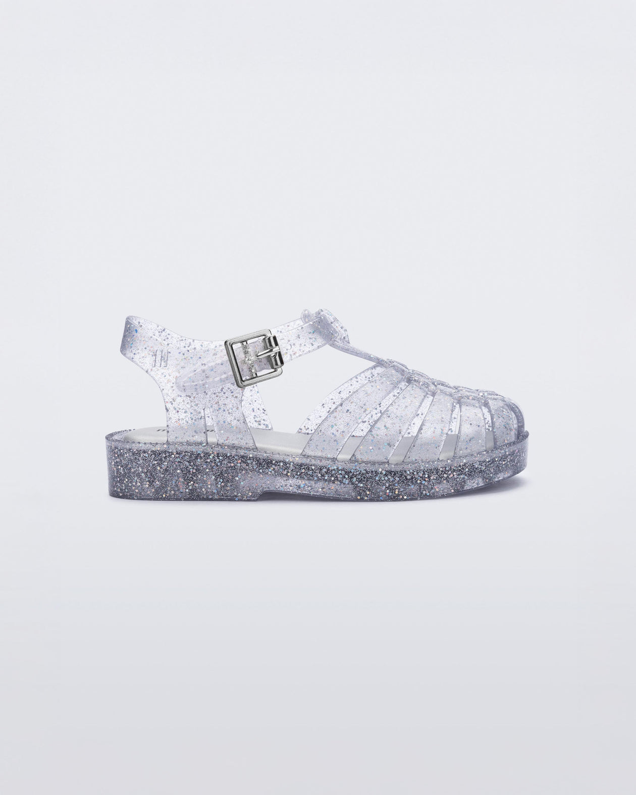 Side view of a silver glitter Possession baby fisherman sandal