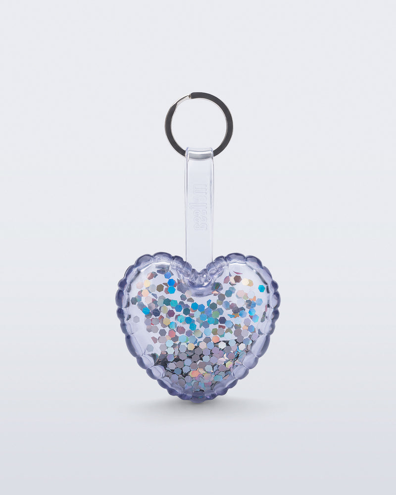 front view of a clear with glitter Heart bag charm