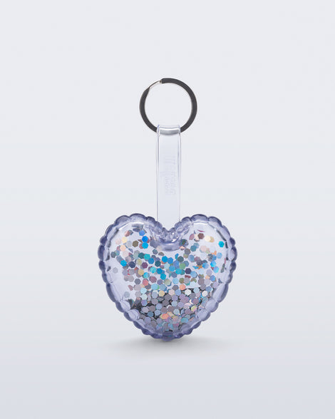 front view of a clear with glitter Heart bag charm