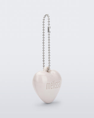 Angled view of a beige Heart Charm