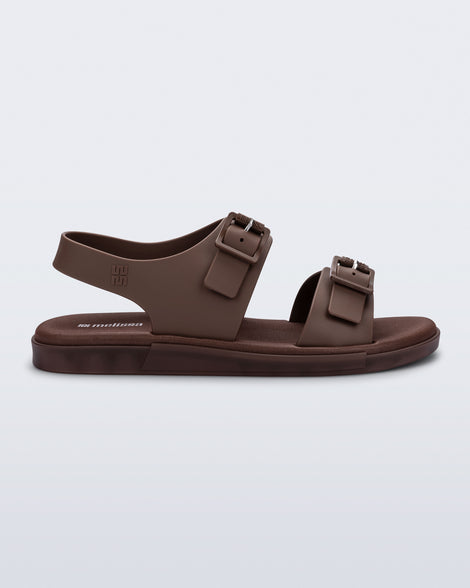 Side  view of a brown Wave Sandal with two straps with buckles and a back strap