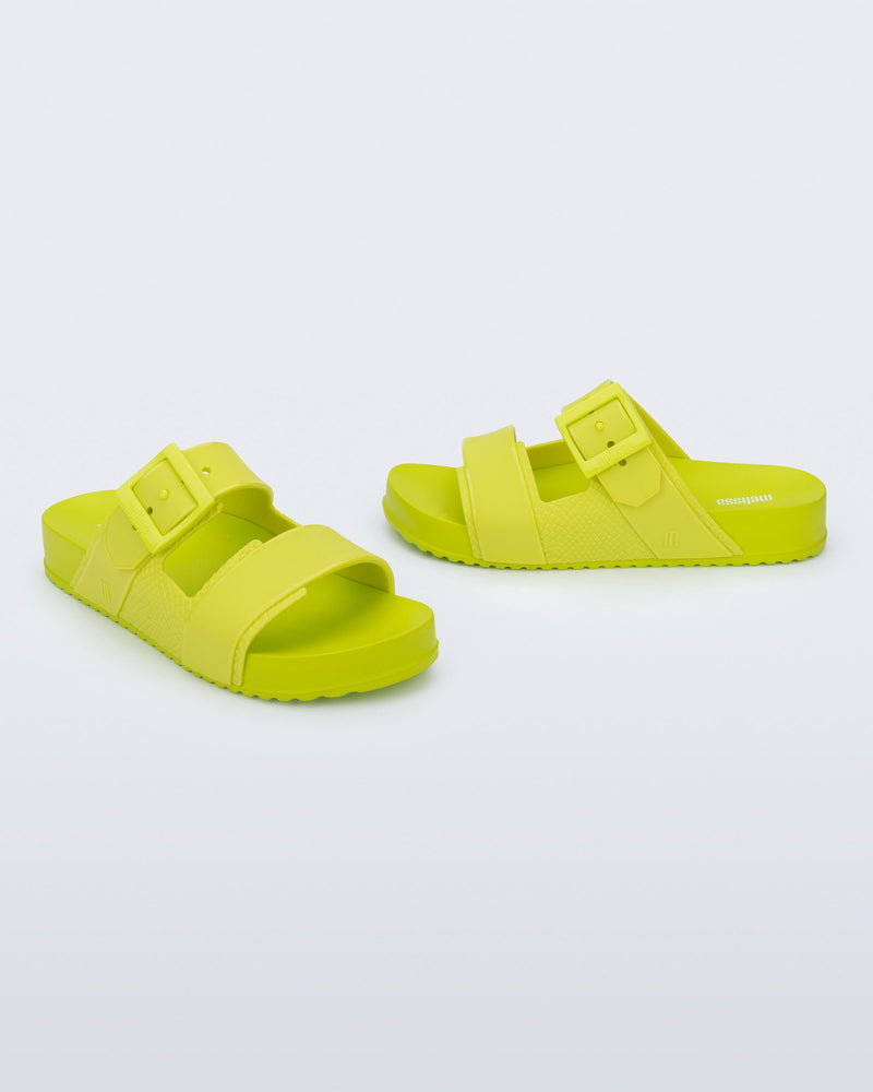 Angled view of a pair of green Cozy Connection slides