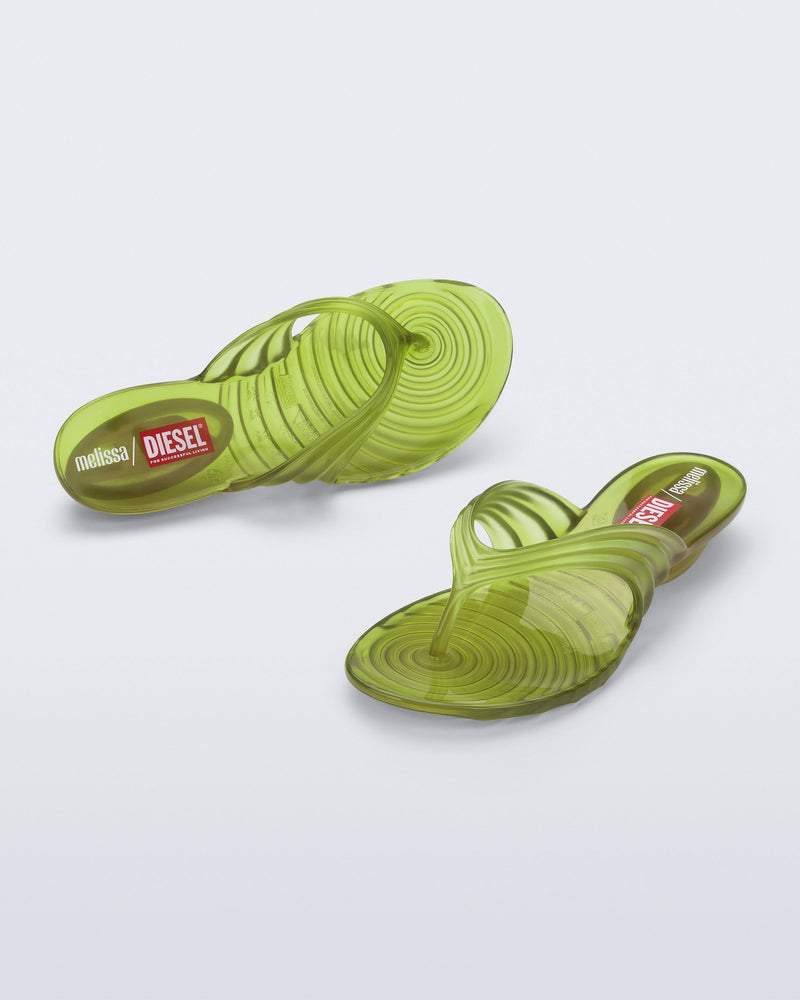 Top and angled view of a pair of clear yellow Quantum Flip Flips