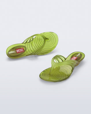 Top and angled view of a pair of clear yellow Quantum Flip Flips