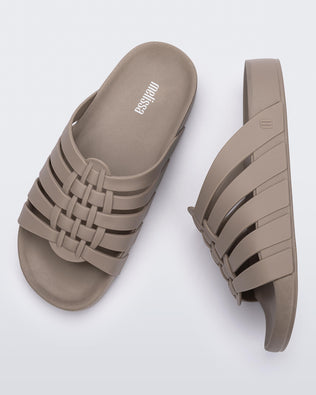 Top and side view of a pair of beige Possession Slide