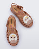 Top view of a pair of beige Possession + Pop Mart Pucky fisherman kids sandal