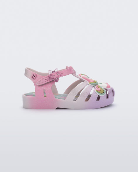 Side view of a purple/pink Possession Unicorn baby sandal with unicorn on front upper