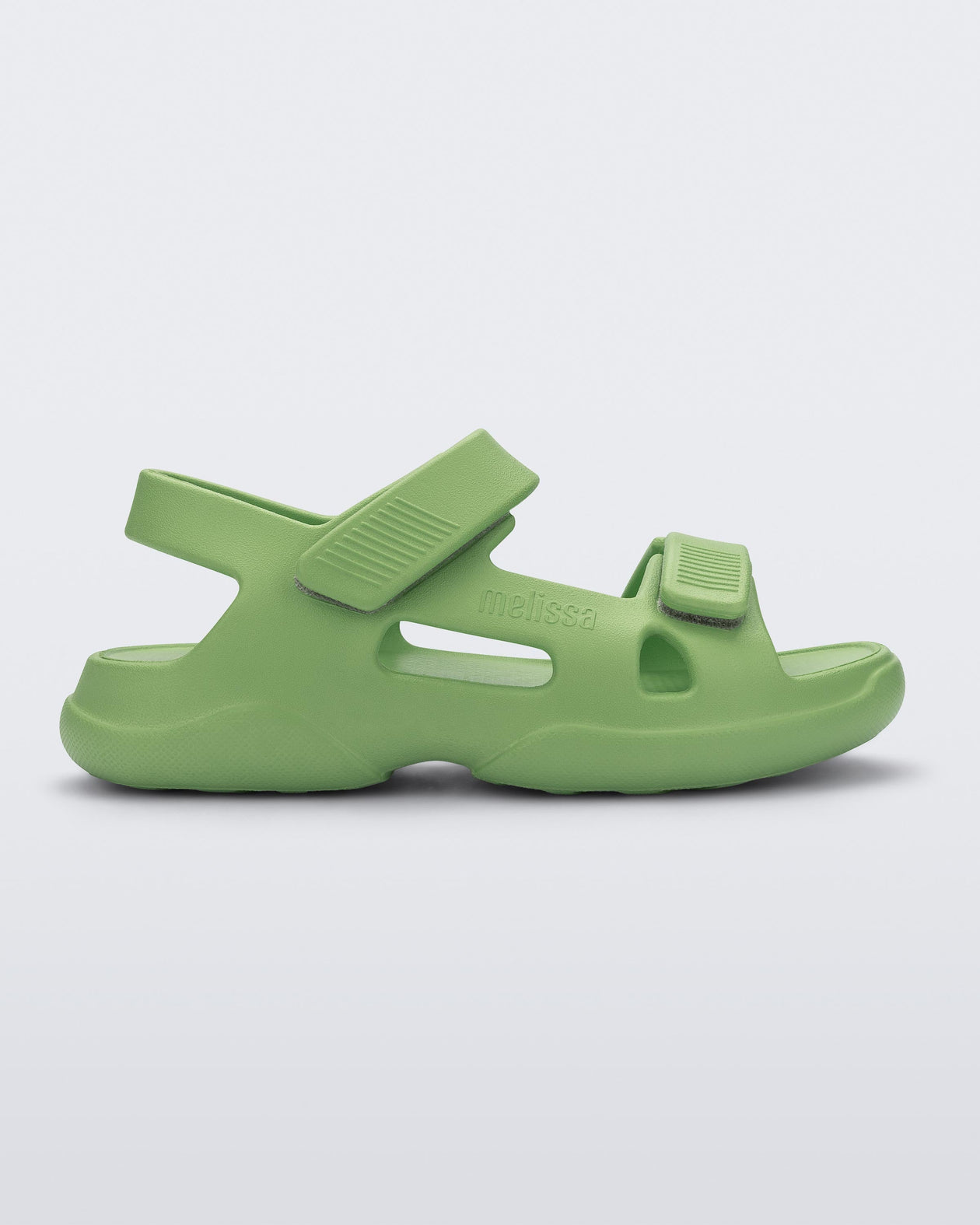 Side view of a green Free Papete sandal