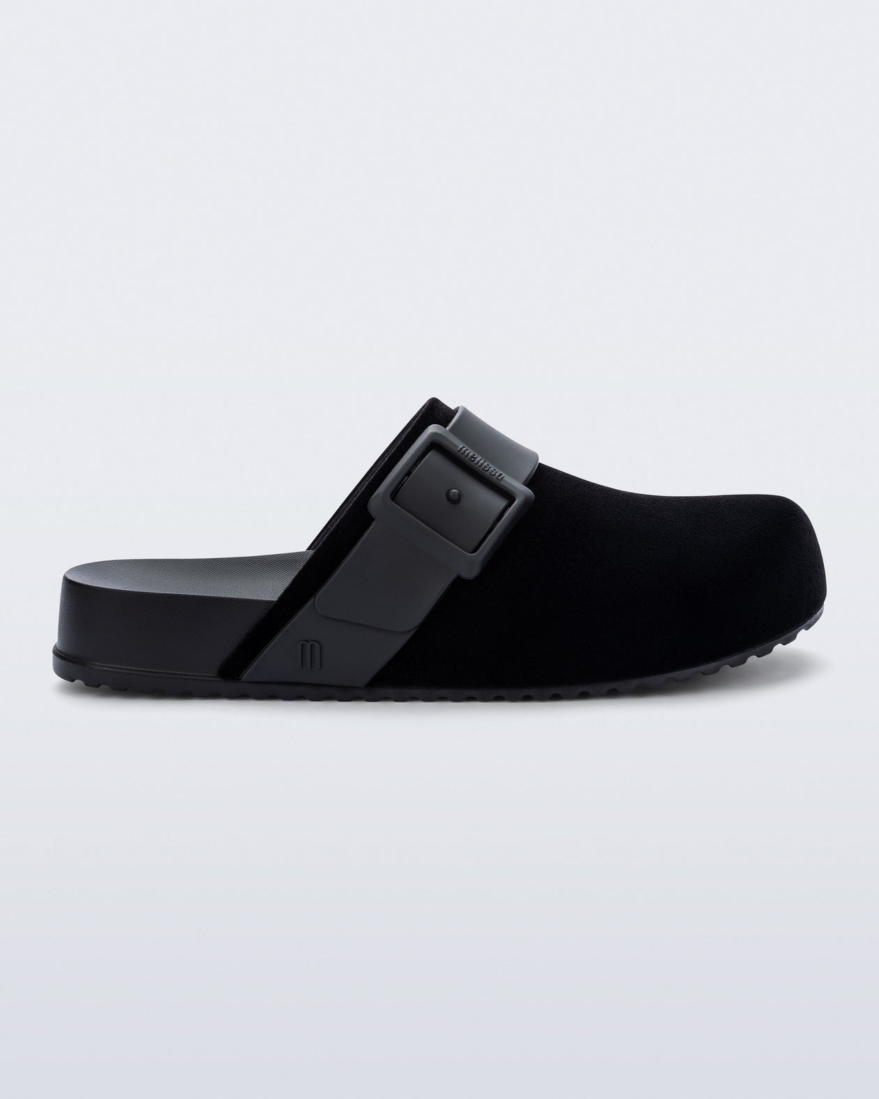 Side view of a black Cozy Clog Velvet slides