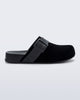 Side view of a black Cozy Clog Velvet slides