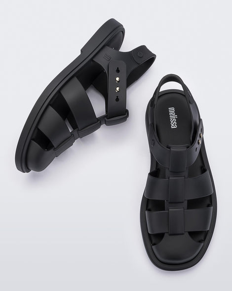 Side and top view of a pair of black Emma women's sandals.